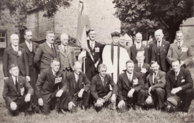 British Legion 1936.jpg - Long Preston Branch of the British Legion 1936  Picture taken on the Village Green on the day the British Legion Standard was dedicated.  From left to right:   Back Row:  A.Collishaw  - Neal Criddings - A.Jackman RFC - J Handley S/B - J.Roberts - Rev. G.H.Midgley - H.Horner  - H.Astley - Jim Capstick - Capt. J Beecroft MC MD  Front Row:  R.Slater DWR - Sgt A.Carr  MM CDLDL - (unknown) - H.Lupton - T.Harding - E.Woodcock - H.Metcalfe - Joe Parker DWR
